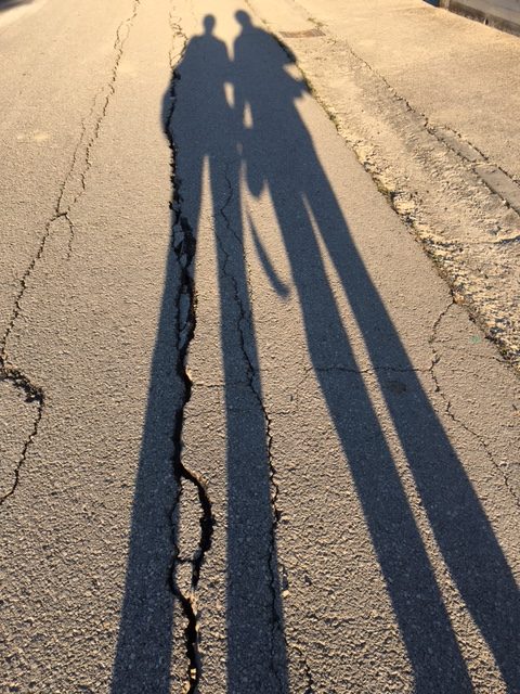 AP team of Trisha Thomas and Gregorio Borgia cast long shadows on the deserted, creviced street of Pescara Del Tronto the morning after the earthquake. August 25, 2016 Photo by Trisha Thomas