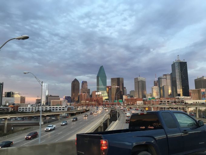 A view of the Dallas skyline from the highway as a pickup truck drives by. Photo by Trisha Thomas, December 22, 2016