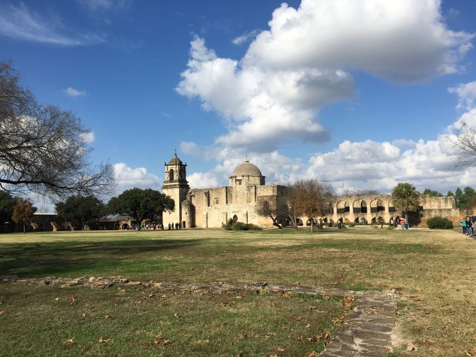 The large grassy central area of the San Jose Mission. The church is in the background. Photo by Trisha Thomas, December 26, 2016, San Antonio, Texas