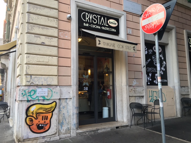 Graffiti on wall near coffee bar on Via Flaminia in Rome. It looks like Trump to me and it is near the "Do not Enter" road sign. Photo by Trisha Thomas, February, 2015