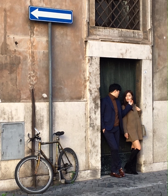 Chinese couple poses for a photo on Via Della Gatta Rome, Februaury 10, 2016. Photo by Trisha Thomas