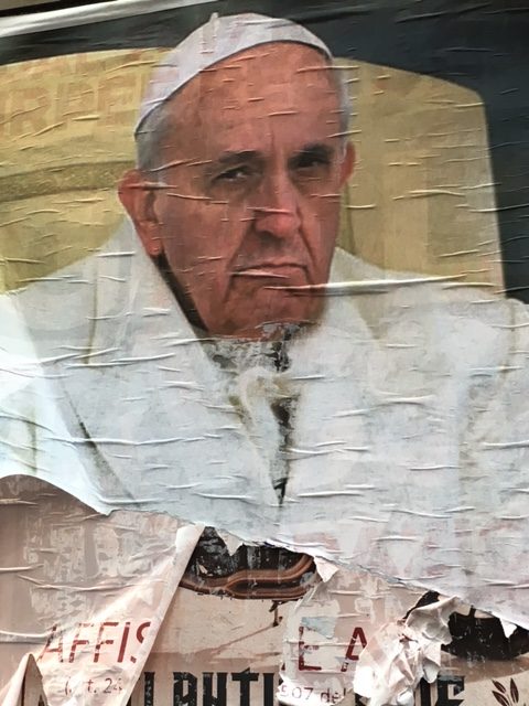 A poster showing a grouchy looking Pope that was plastered all over Rome. Photo by Trisha Thomas, February 9, 2016