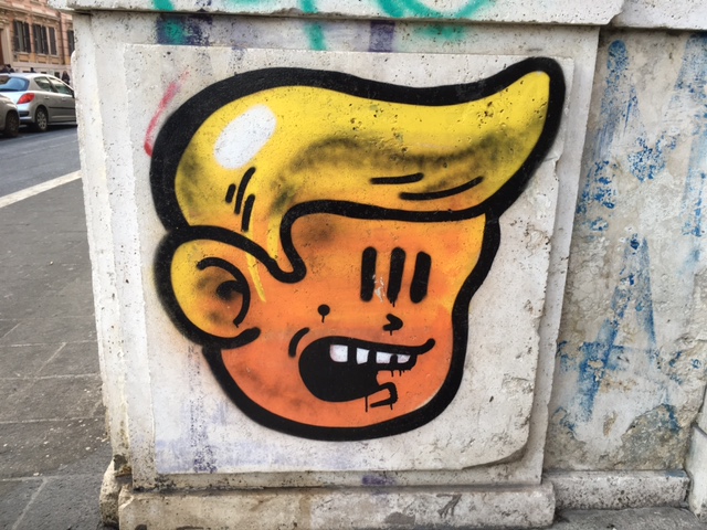 Is this graffiti supposed to be Donald Trump? I pass it every morning on the tram on Via Flaminia heading to work. Photo by Trisha Thomas, February 2016