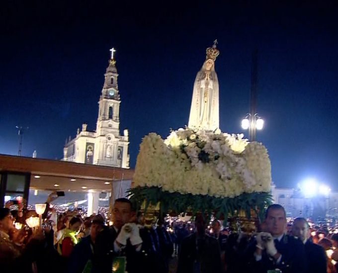 The statue of Our Lady of Fatima carried across the esplanade in front of the Basilica by eight bearers. Freeze frame of host broadcaster video. Fatima, Portugal May 13, 2017.