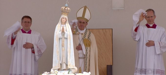 Pope Francis waves a white handkerchief as he says goodbye to Our Lady of Fatima. Freeze frame of video of Host Broadcaster. May 13, 2017. Fatima, Portugal. 