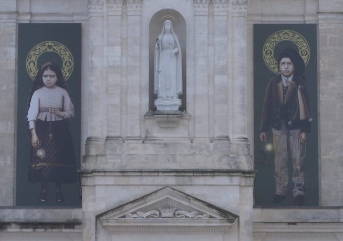 Portraits of Francisco and Jacinta Marto - the two shepherd children - displayed on the Basilica of Our Lady of Fatima for their canonization ceremony. Freeze frame of video shot by AP video-journalist Pietro De Cristofaro. Fatima, Portugal, May 13, 2017