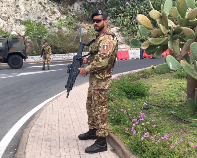 Italian soldier blocks the road that leads up to the town of Taormina. April 25, 2017 - Photo by Trisha Thomas